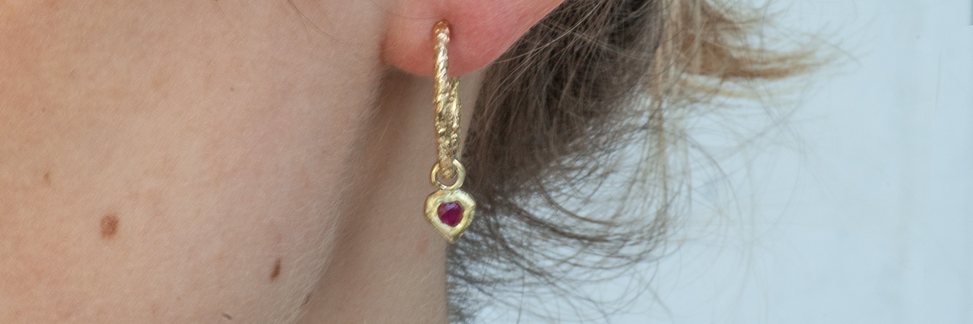Solid gold earrings made from recycled 9ct gold, studs, hoops and drop earrings ethically handmade in the UK by Amulette