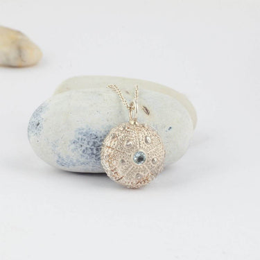 sea urchin silver necklace with blue stone